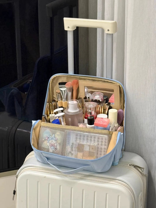 Open light blue makeup organizer with brush holders and divided storage