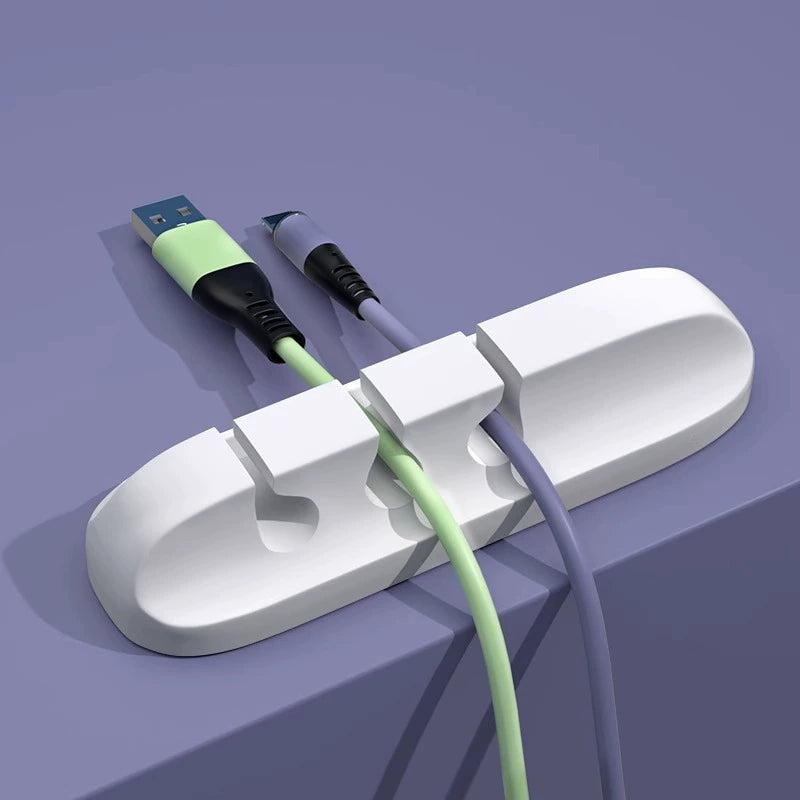 White three-slot cable organizer holding two cables
