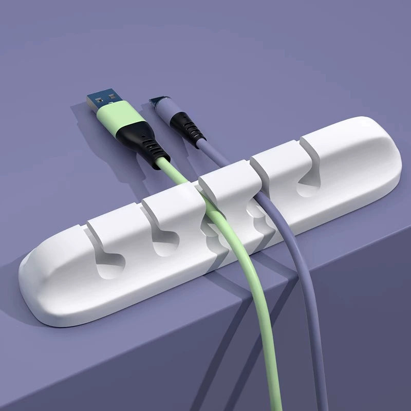 White five-slot cable organizer holding two cables
