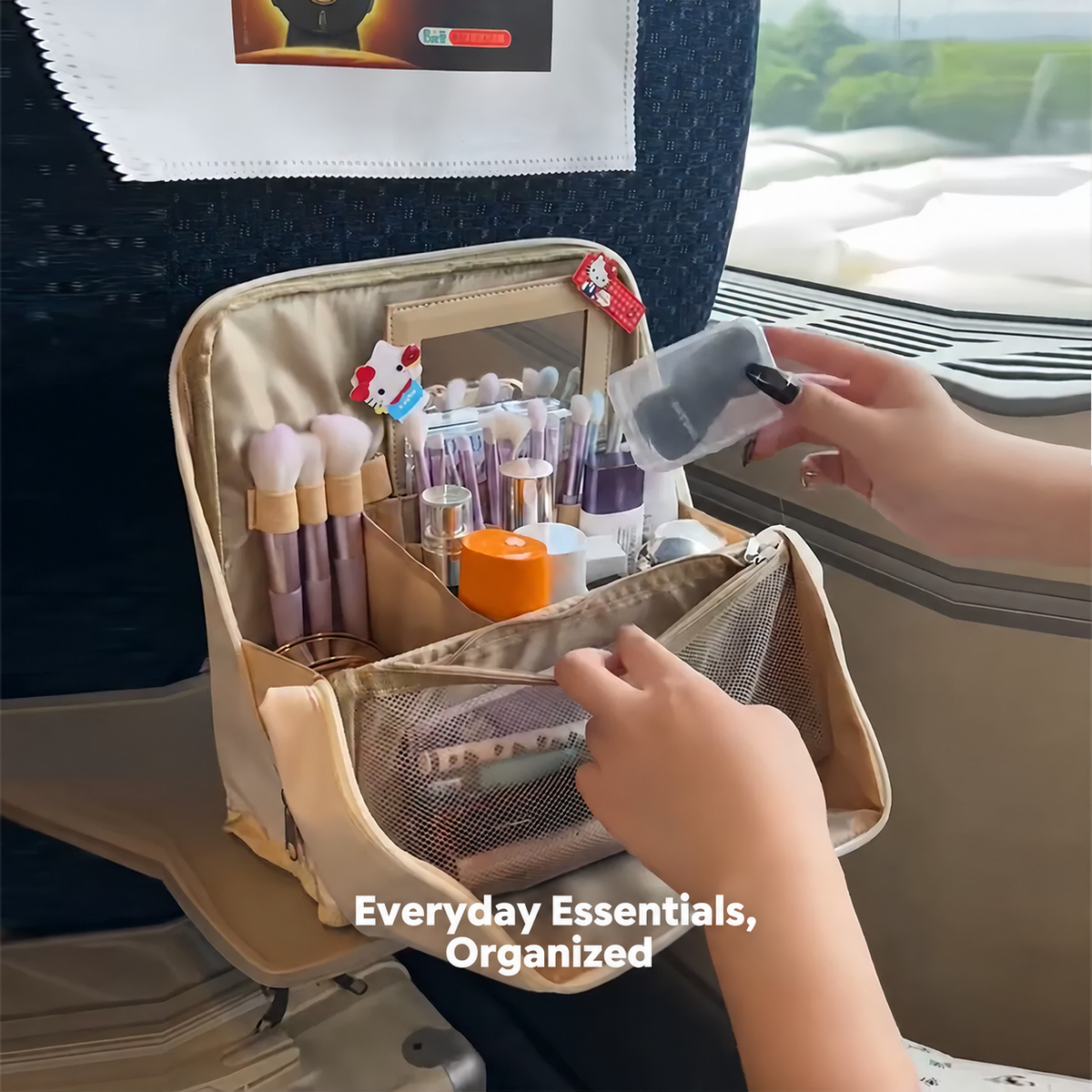 Beige makeup organizer open with divided storage and brush holders
